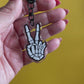 Skeleton Rock On Keychain